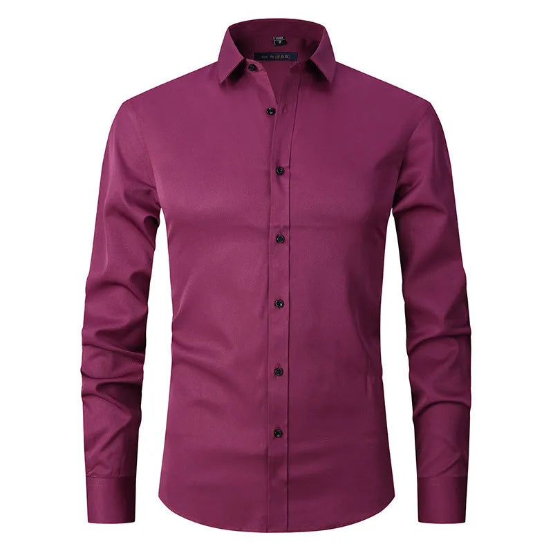 Man wearing a stretch long sleeve work shirt in a solid colour, showing the fit and style.