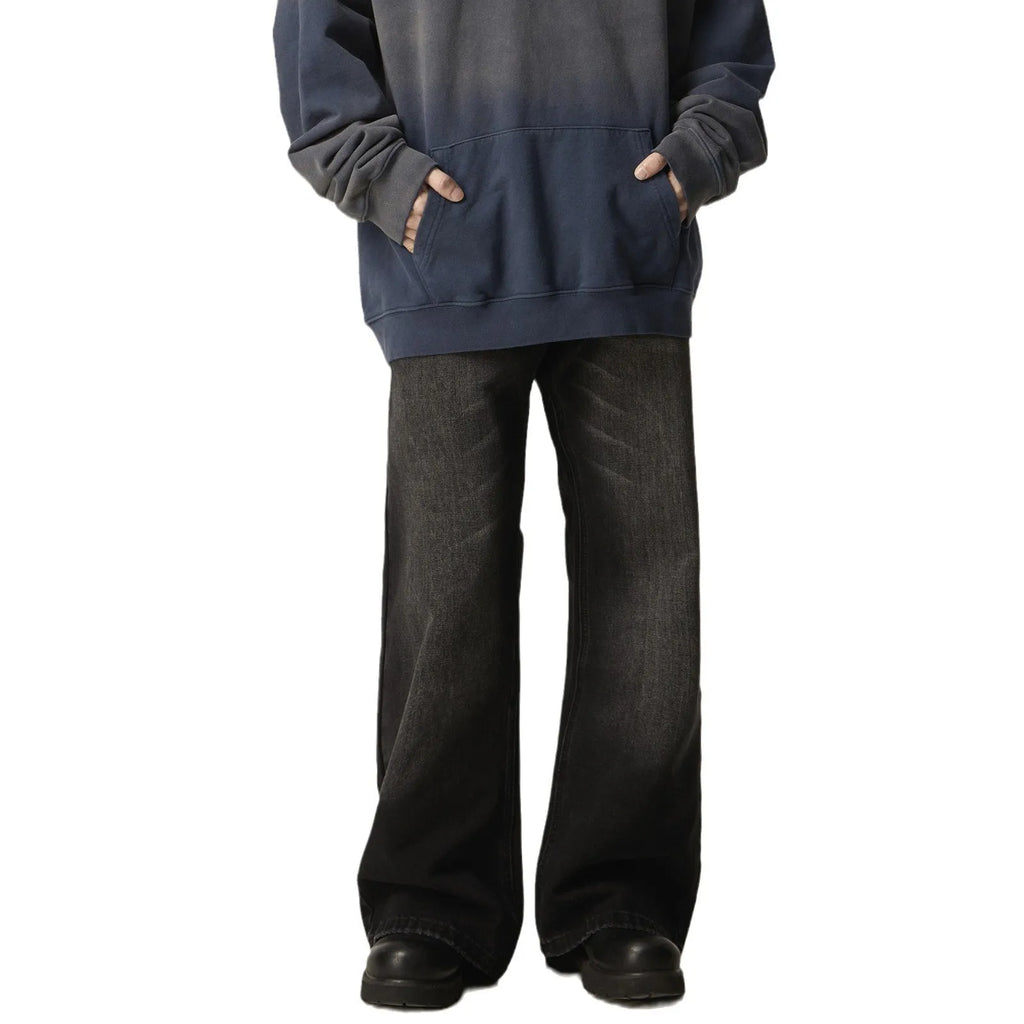 Black loose straight jeans with retro styling and zipper fly on mannequin