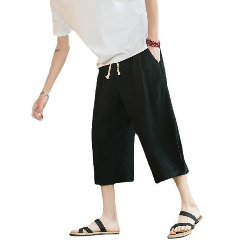 Plus size straight-leg linen shorts with skinny ankle opening in khaki, shown on a hanger.