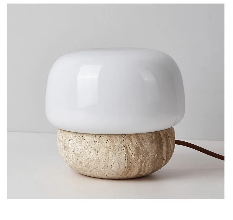 Cream coloured retro bedside lamp with button switch on small table