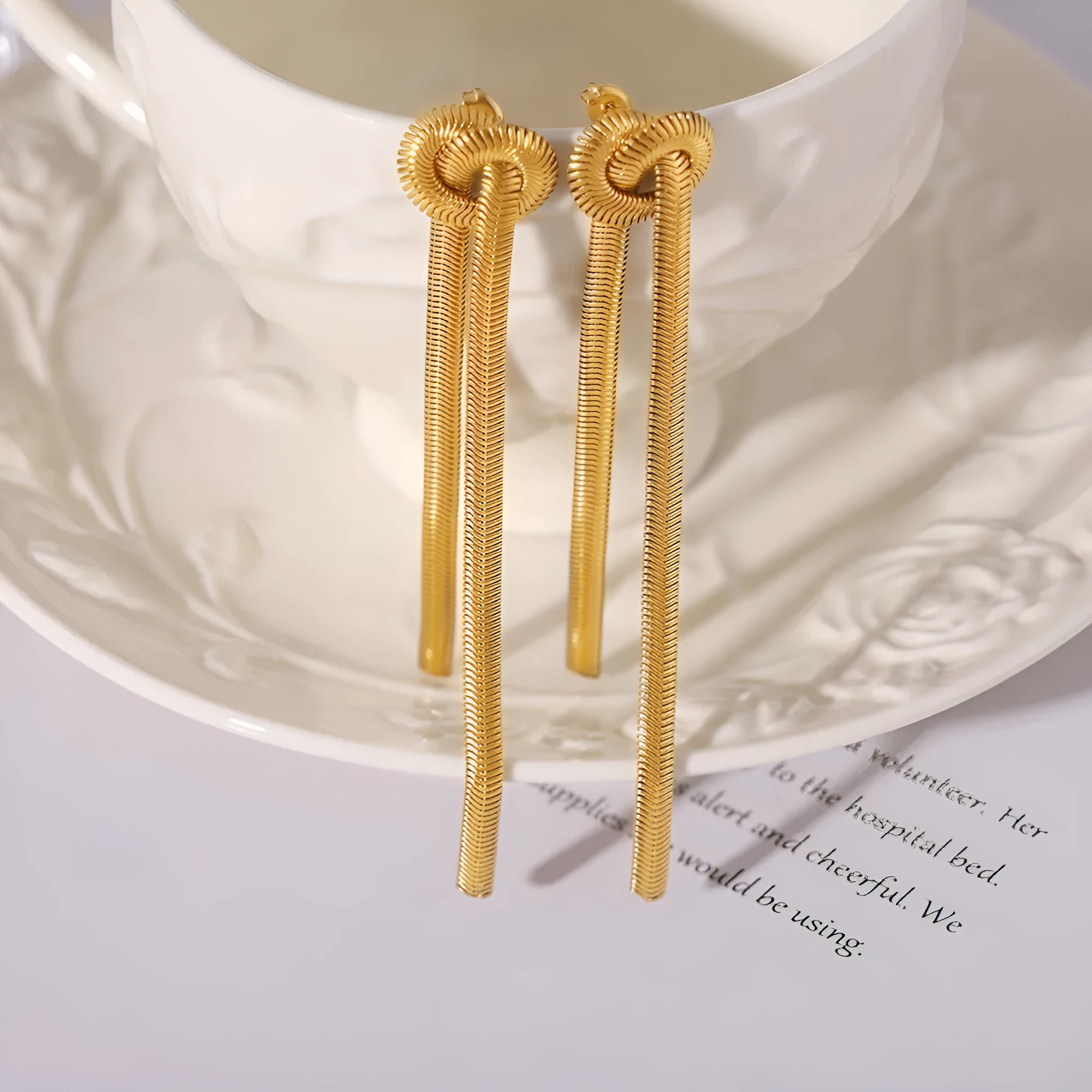 Gold electroplated titanium steel necklace with knotted tassel pendant and matching earrings set for women