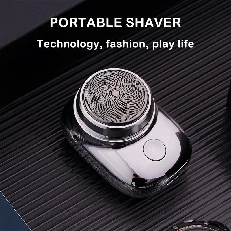 Mini portable USB electric shaver in silver with rotary head, aluminium body, and IPX7 wet and dry use