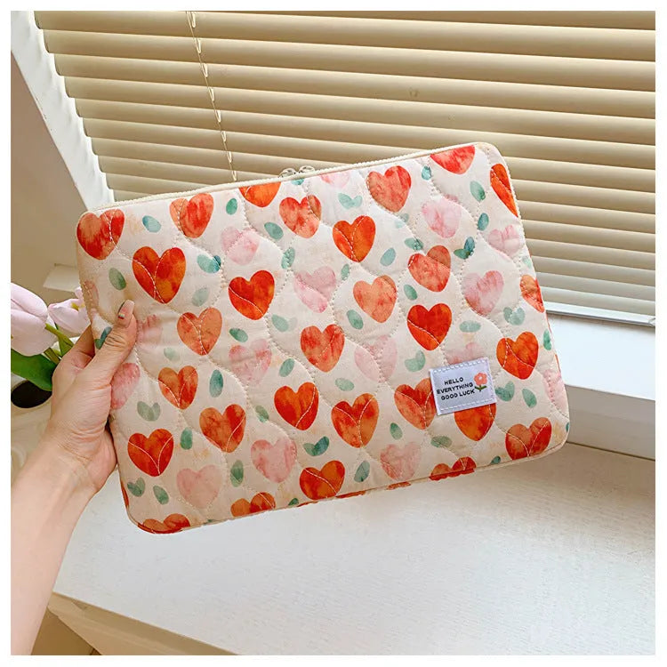 Women's floral print cloth laptop bag shown in green flower pattern, with anti-seismic feature.
