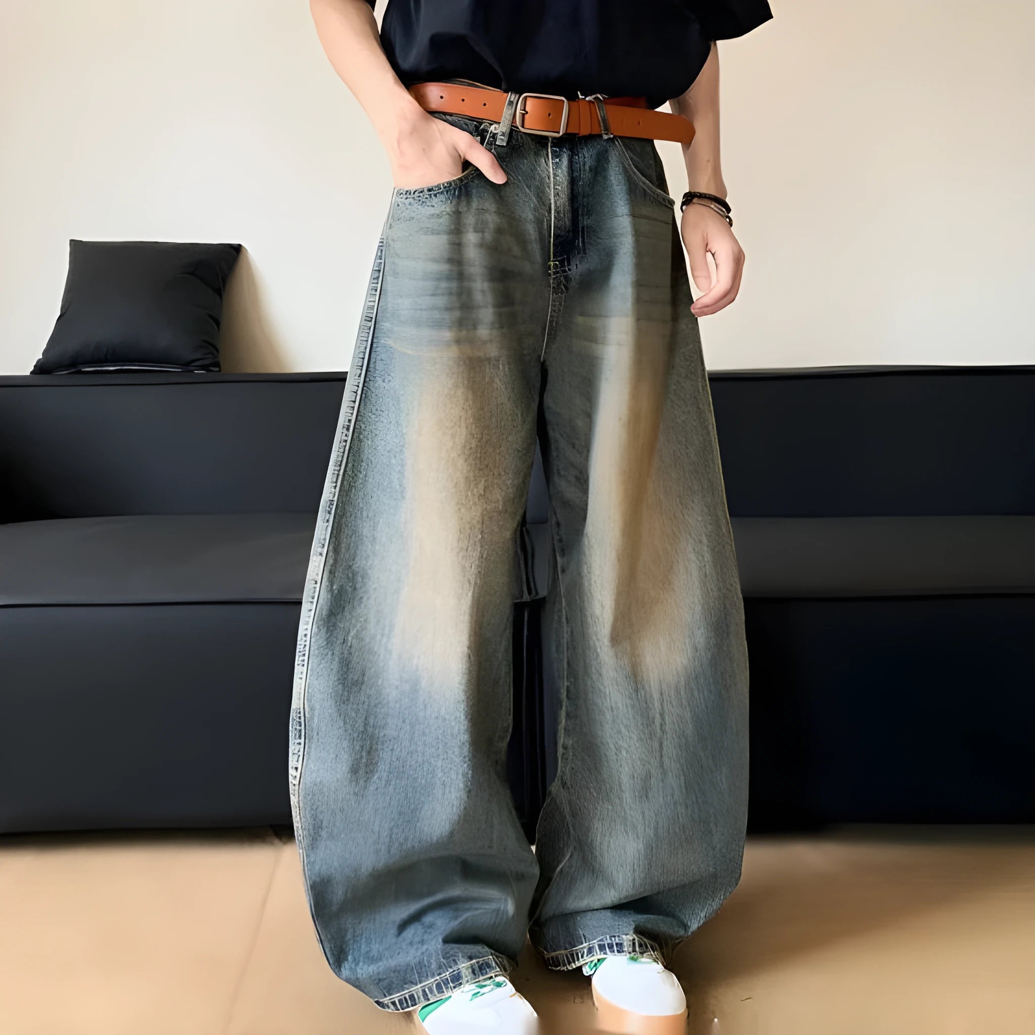 Men's retro blue distressed denim wide-leg trousers showing slim fit and vintage detailing
