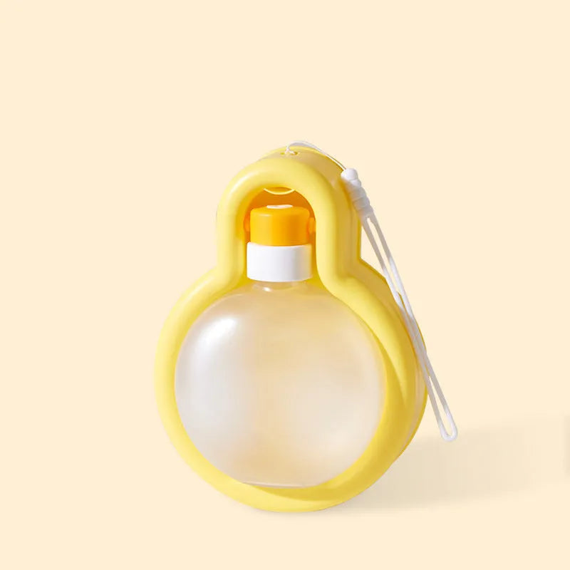 Green portable dog water bottle with pull-out drinking bowl for travel and outdoor use