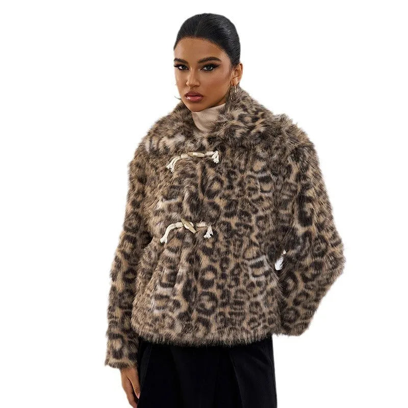 Women's leopard print polyester coat with regular sleeves on a hanger