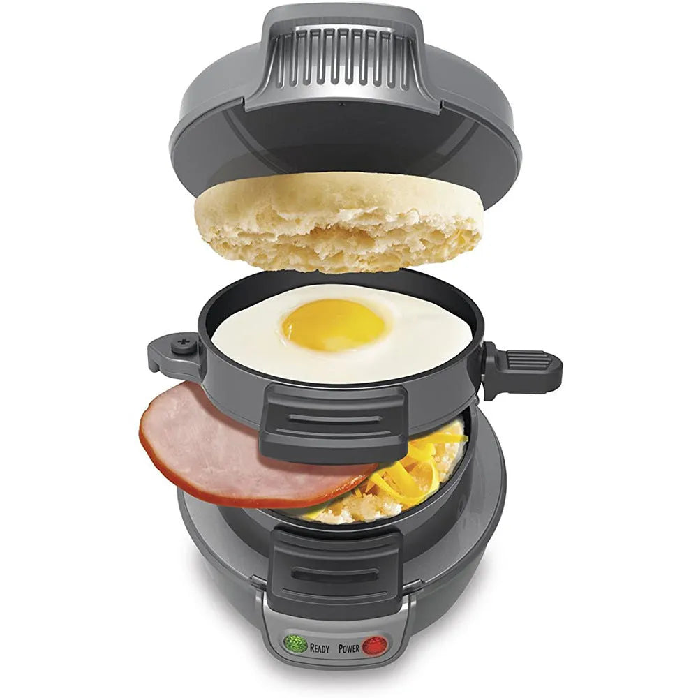 Bright red multifunction breakfast machine with sandwich press and egg cooker ring on baking tray