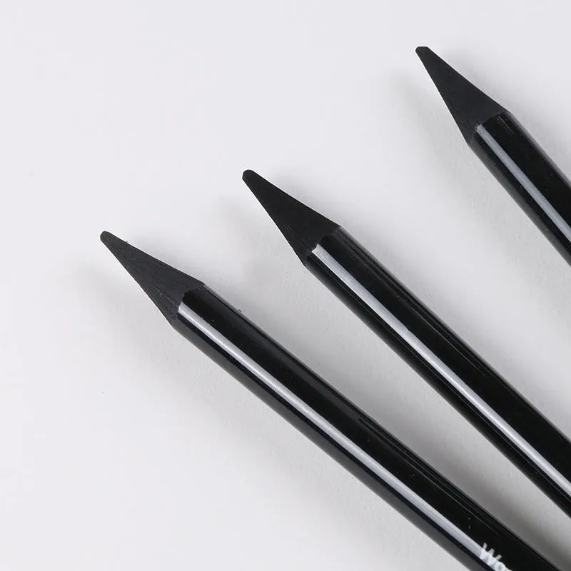 Carbonised and graphite drawing pencil set of nine in a wooden case, showing six graphite and three carbonised pencils.