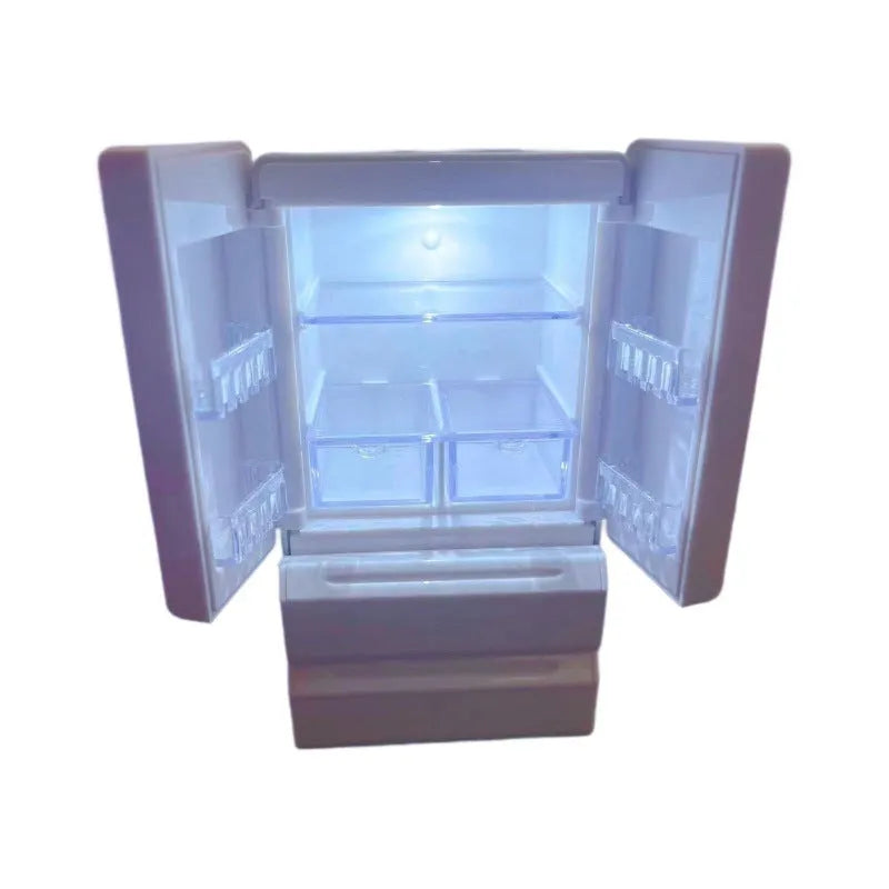 White plastic miniature candy toy model with illuminated light function, shown on a desk.