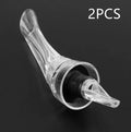 Clear acrylic wine aerator with stainless steel filter measuring 16x4.2cm pouring red wine into a glass