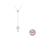 Simple silver love cross necklace on a V-neck O-ring chain for women.