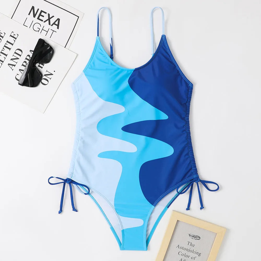 Women's blue one-piece swimsuit with sleeveless design and fixed swimming trunks