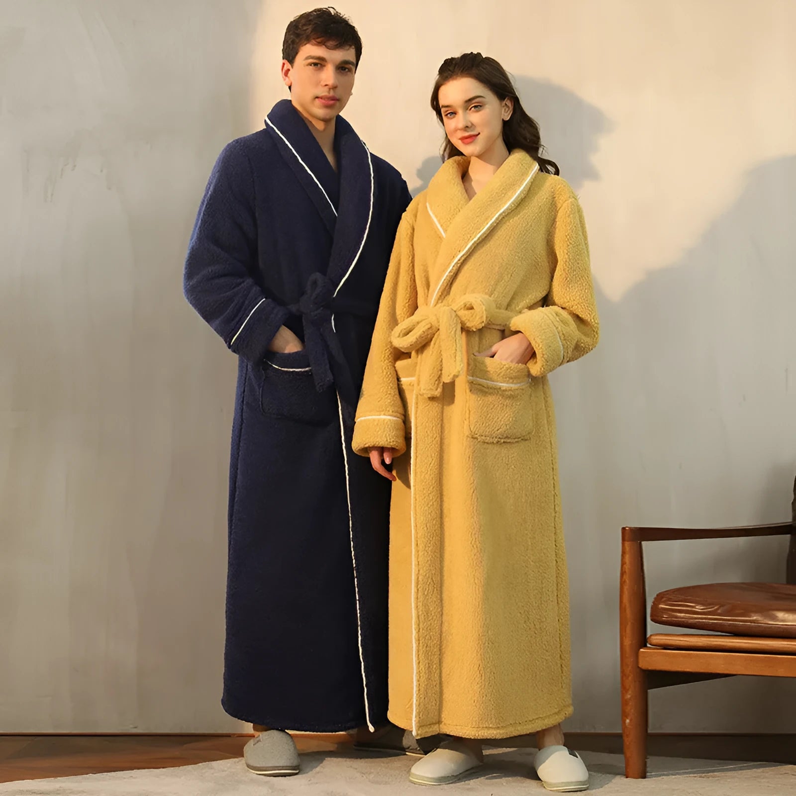 Man and woman wearing matching thick plus size flannel bathrobes in Angola red, winter nightgown pajamas.