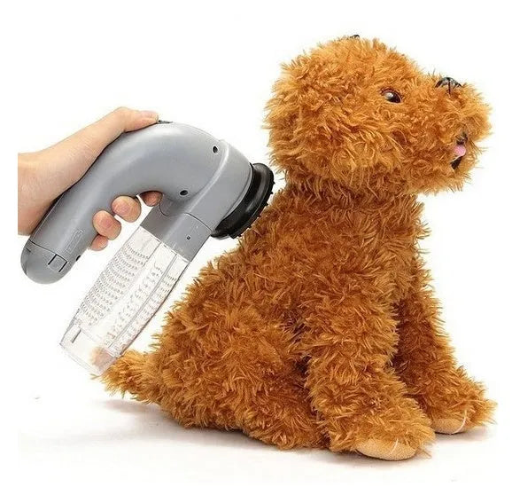 Grey handheld pet grooming vacuum cleaner with soft rubber head for dogs and cats