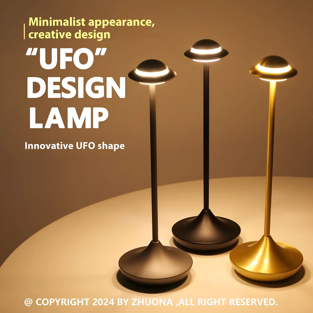 Creative UFO-shaped rechargeable table lamp with metal base in black, gold, or grey colour.