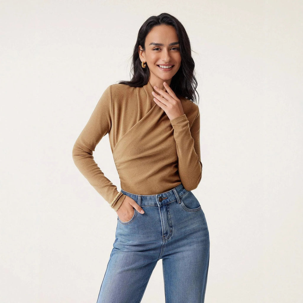 Camel-colour women's slim fit long sleeve pullover sweater on a hanger