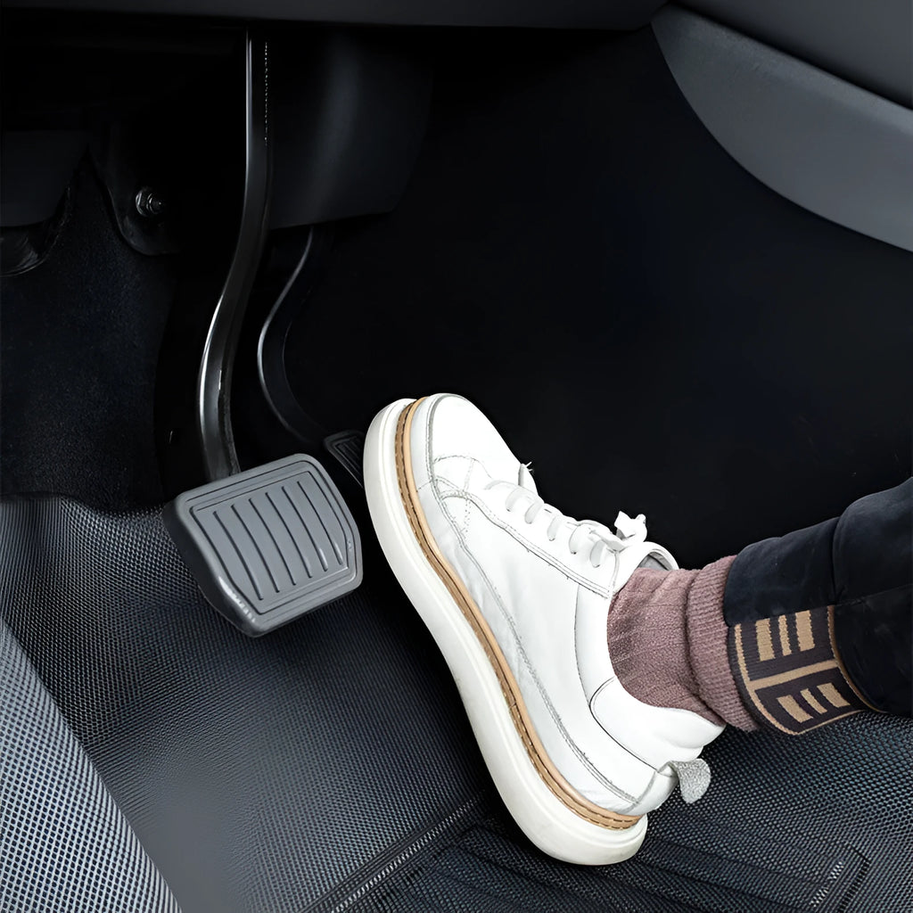 Set of four textured TPR floor mats for a Tesla Model Y, showing foot mats and storage box mats.