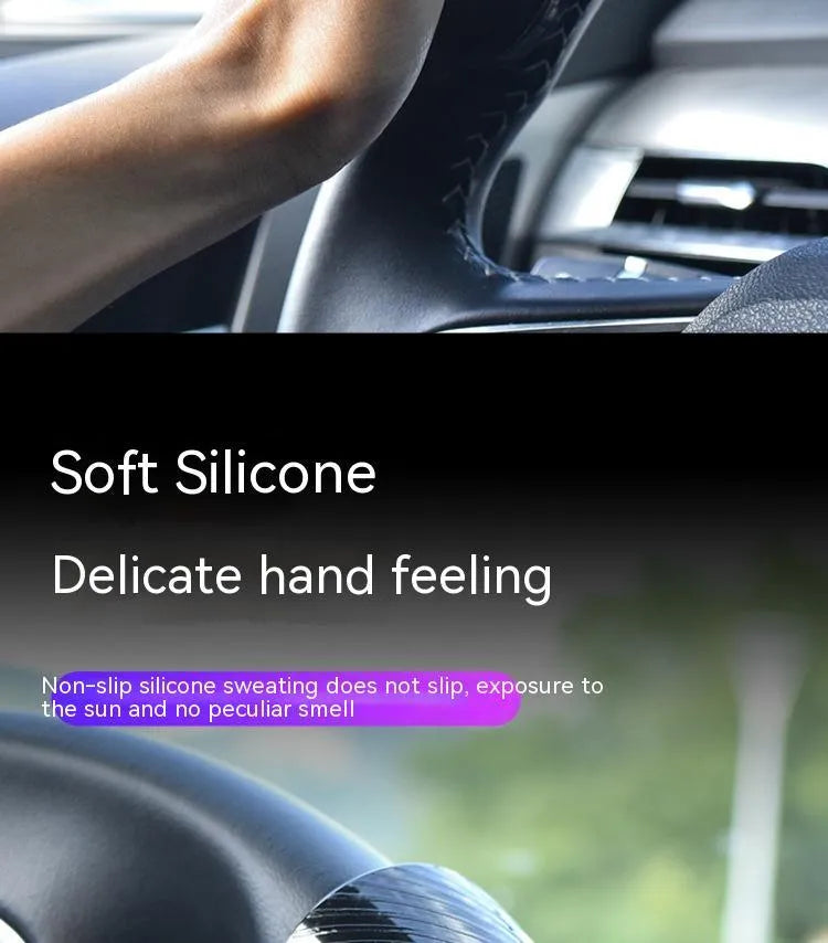 Black and blue silicone steering wheel assist ball for single-handed driving on a car steering wheel.