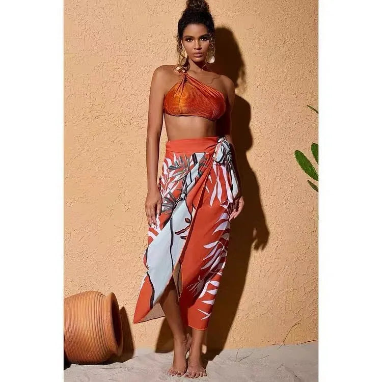 Women's brown push up bikini with high waist briefs and a matching sheer chiffon dress overlay.