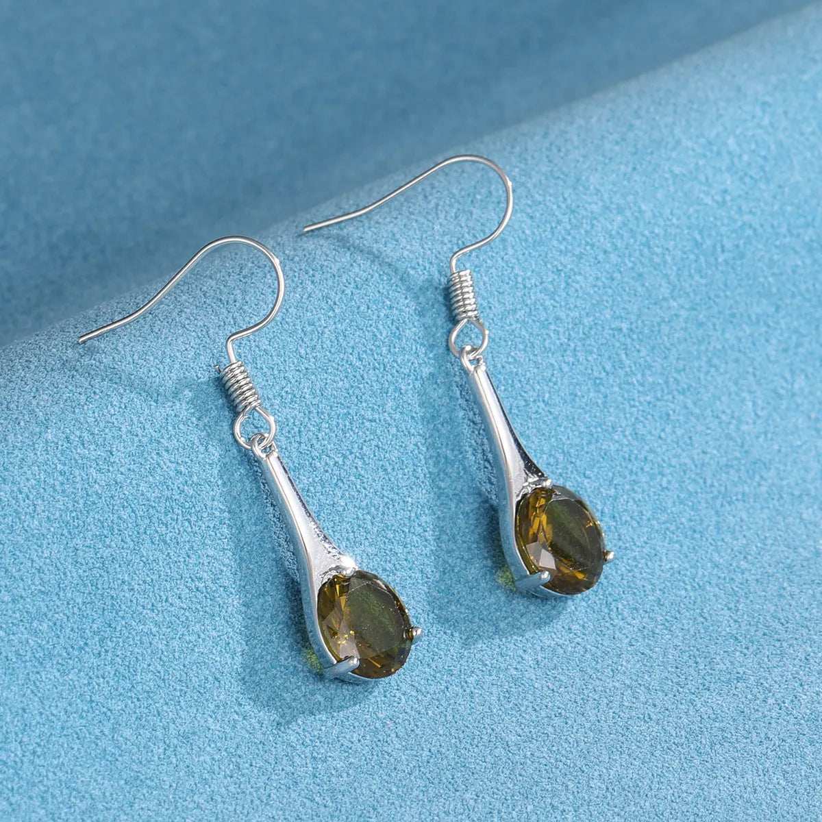 Olive green topaz drop earrings with minimalist water drop shape and retro style