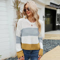 Women's short loose striped pullover sweater in acrylic fabric on a hanger