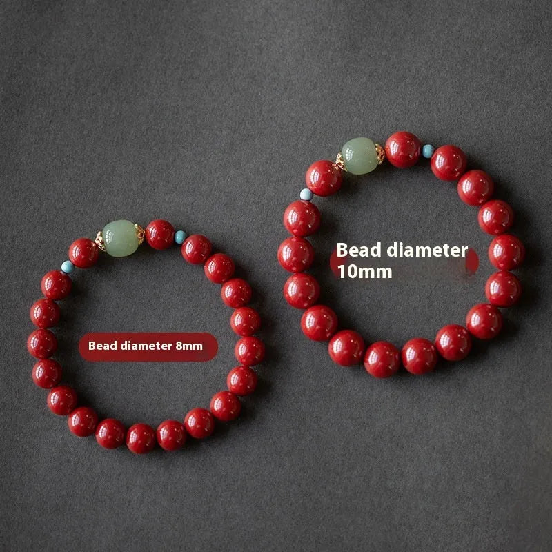 Purple gold sand cinnabar and Hetian jade beaded bracelet with geometric ellipse shapes on a wrist.