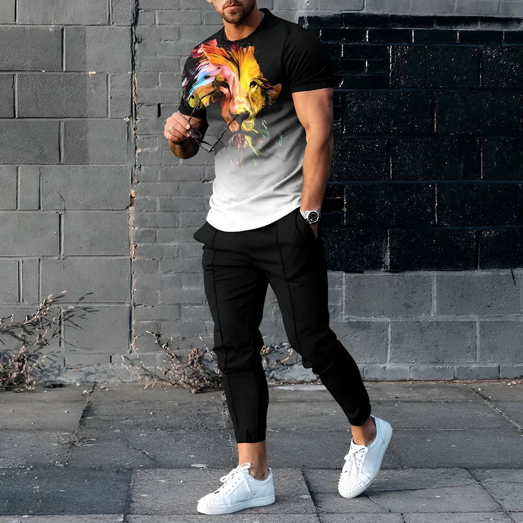 Man wearing a short sleeve printed pullover and matching trousers from a men's two-piece sports set.