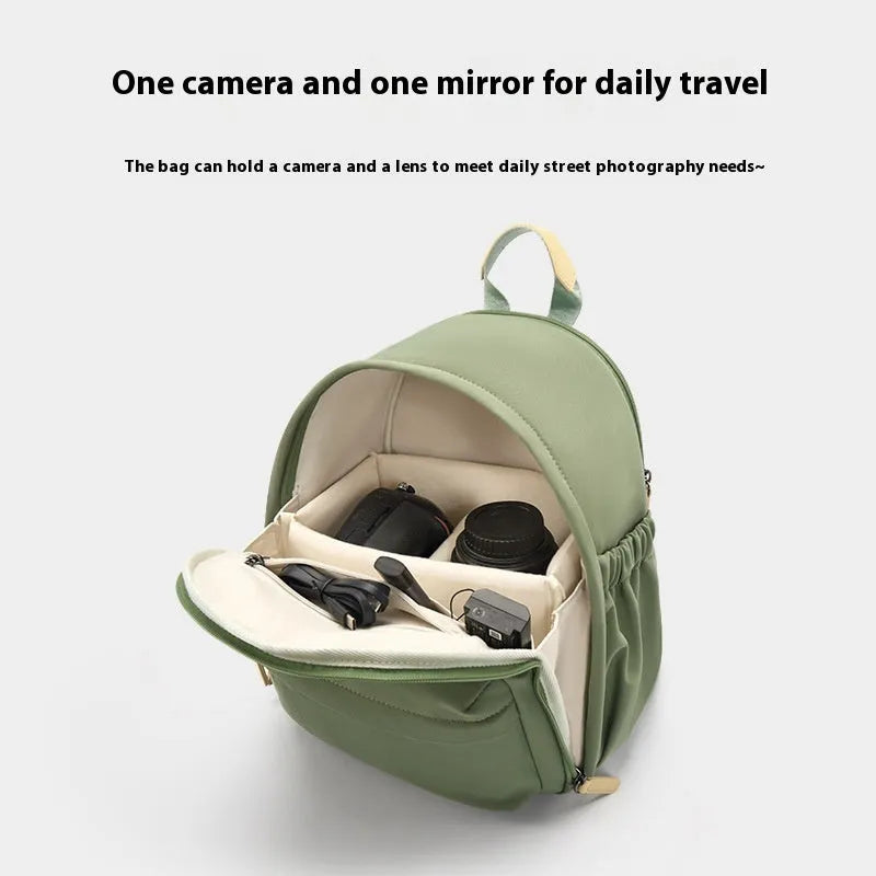 Green polyester shoulder camera bag for women with a detachable iPad compartment on a curve belt.
