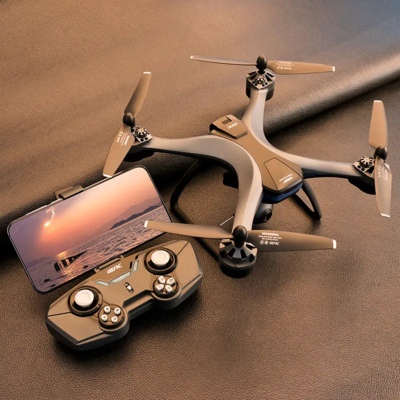 F5 smart ESC quadrocopter drone with dual cameras, remote controller, spare blades, and landing gear on a table.