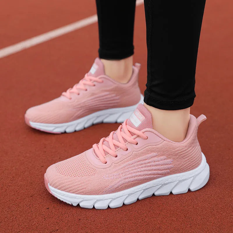 Unisex flyknit running shoes with mesh lining and EVA sole in white, black or pink, sizes 35-44
