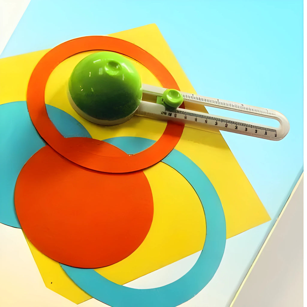 Orange plastic round paper cutter for A3 sheets on a desktop