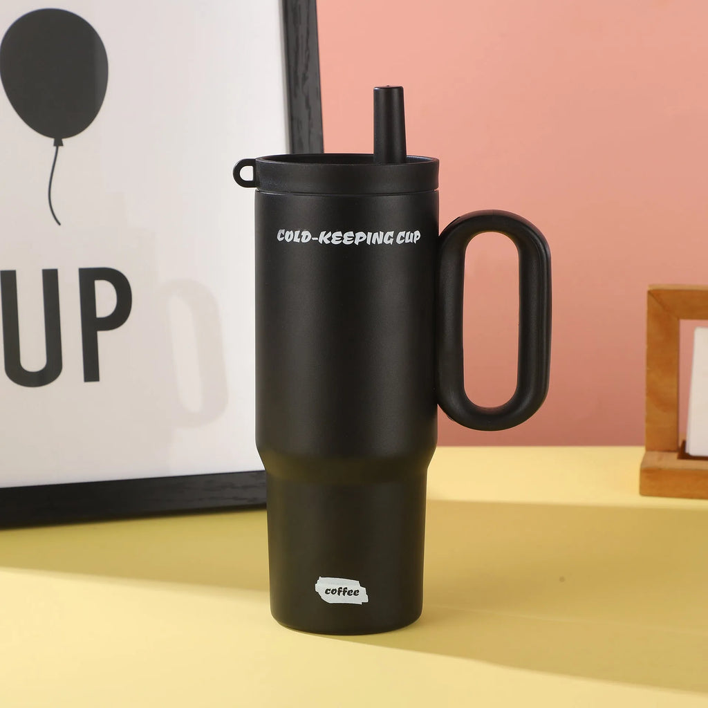 Large insulated tumbler cup with handle and screw-on straw lid