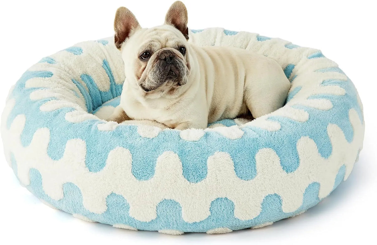 Round plaid dog bed with a plastic base, shown in a sea blue and white colour.