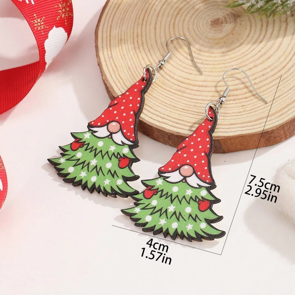 Wooden geometric earrings with printed Christmas tree and snowman Santa Claus designs.
