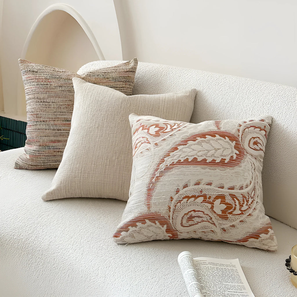American-style yarn-dyed jacquard pillow cover with paisley pattern in amber colours on sofa