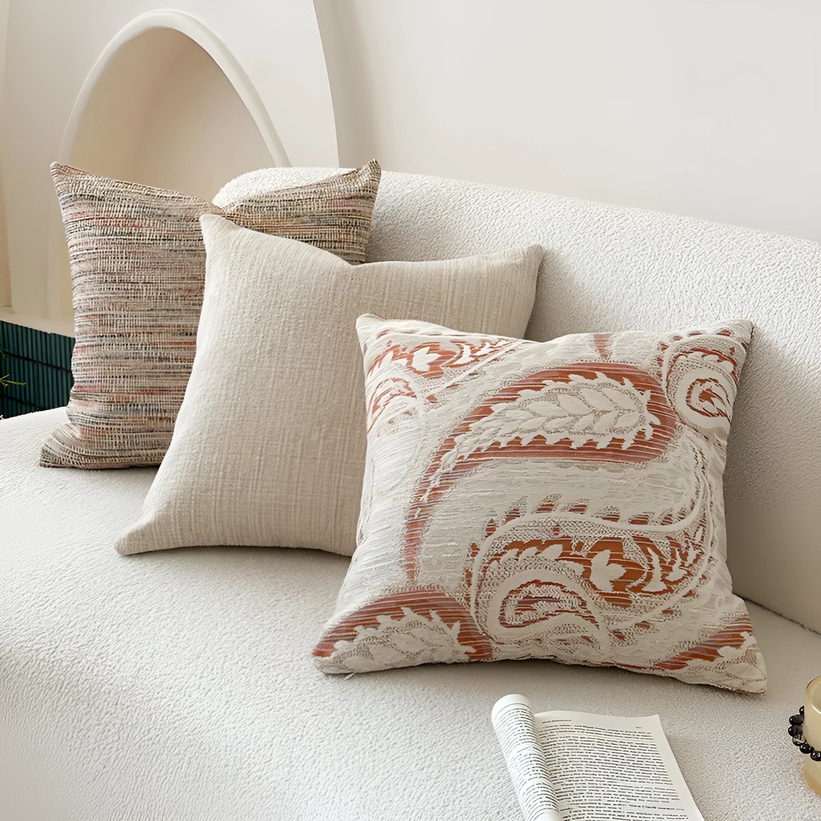 American-style yarn-dyed jacquard pillow cover with paisley pattern in amber colours on sofa