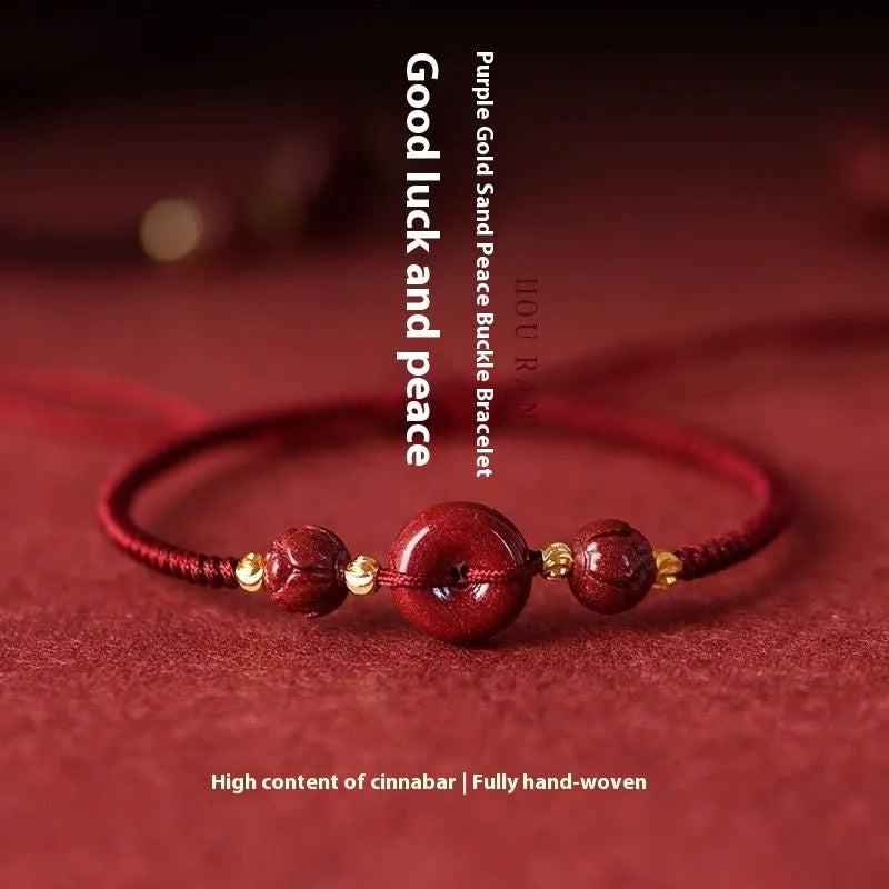 Heart-shaped cinnabar safety buckle bracelet on an adjustable rope cord.