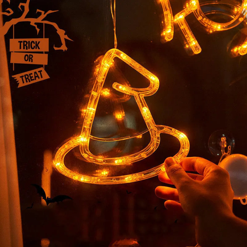 Halloween LED window lights showing spider, pumpkin and ghost designs with suction cup mounting