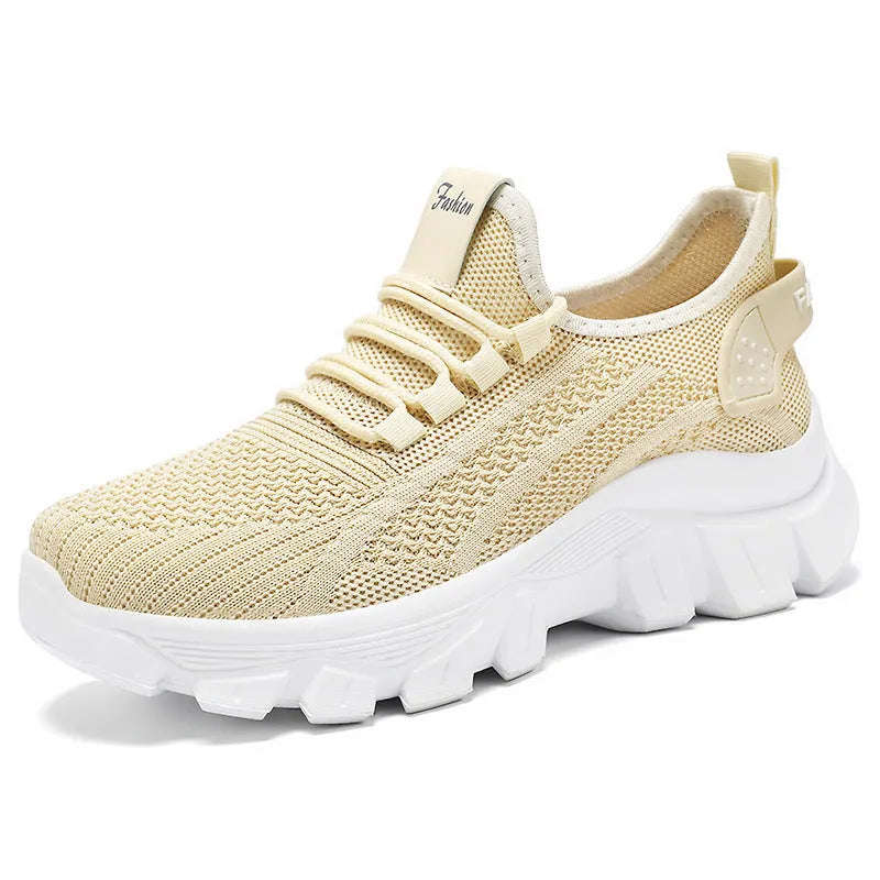 Women's white flyknit running sneaker with thick PVC sole and lace-up front