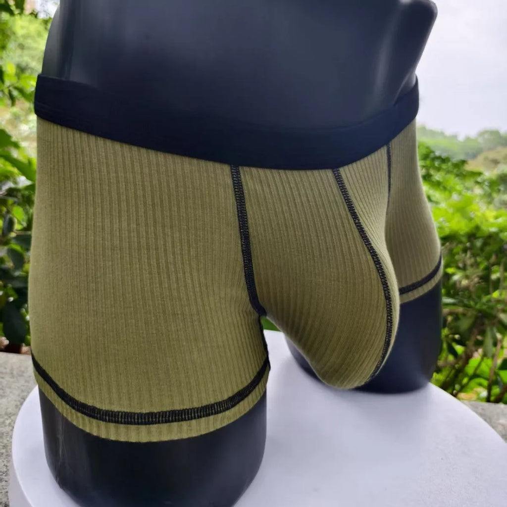 Men's solid colour boxer shorts in Army Green on a white background, showing the breathable fibre fabric.