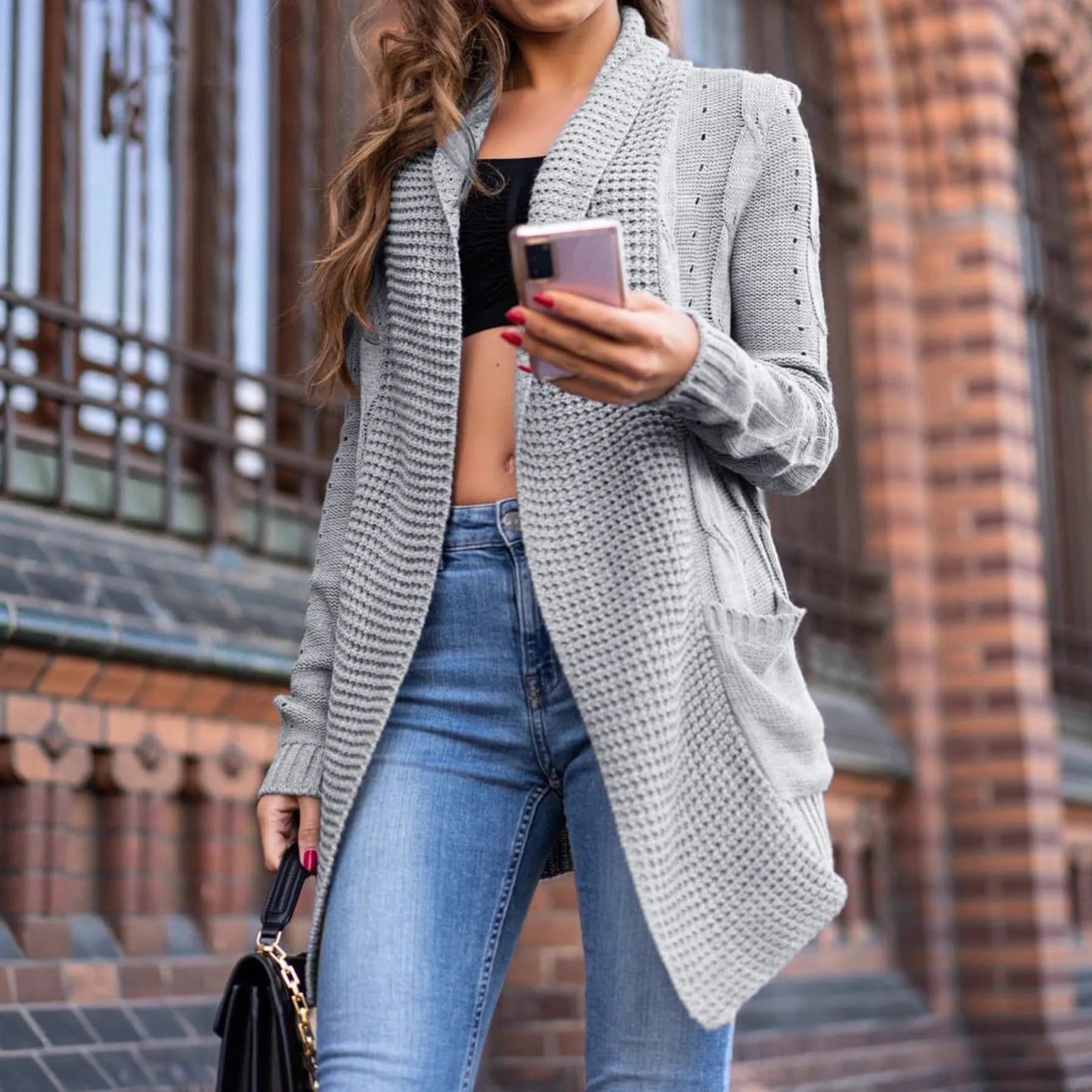 Grey women's loose-fit cardigan coat with pockets, made from thick viscose knit fabric.