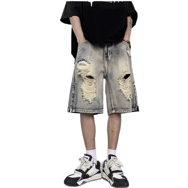 Blue retro-style tattered denim shorts with a wide leg loose fit on a hanger.