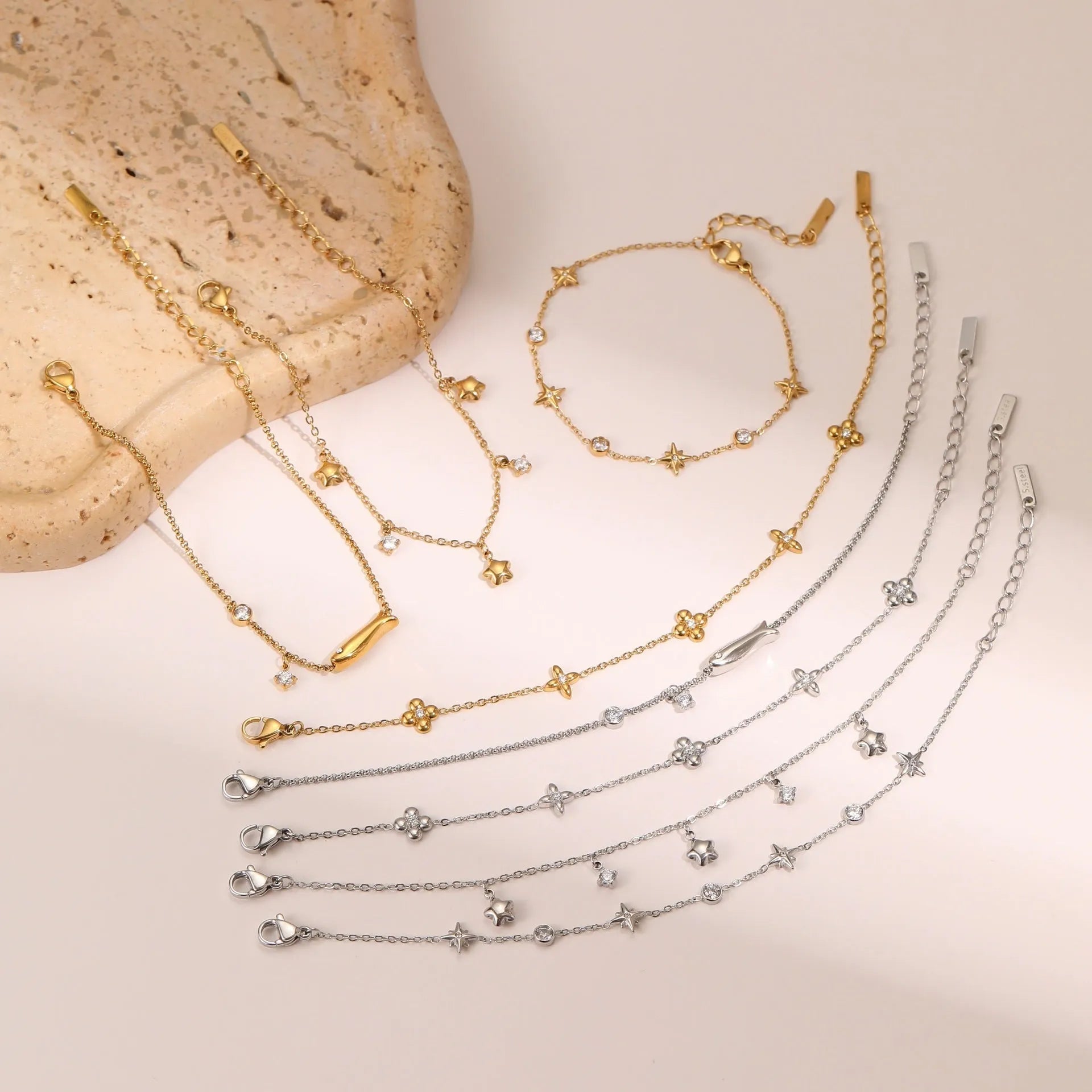 Titanium steel bracelet with 18K gold plating and geometric zircon star pendant