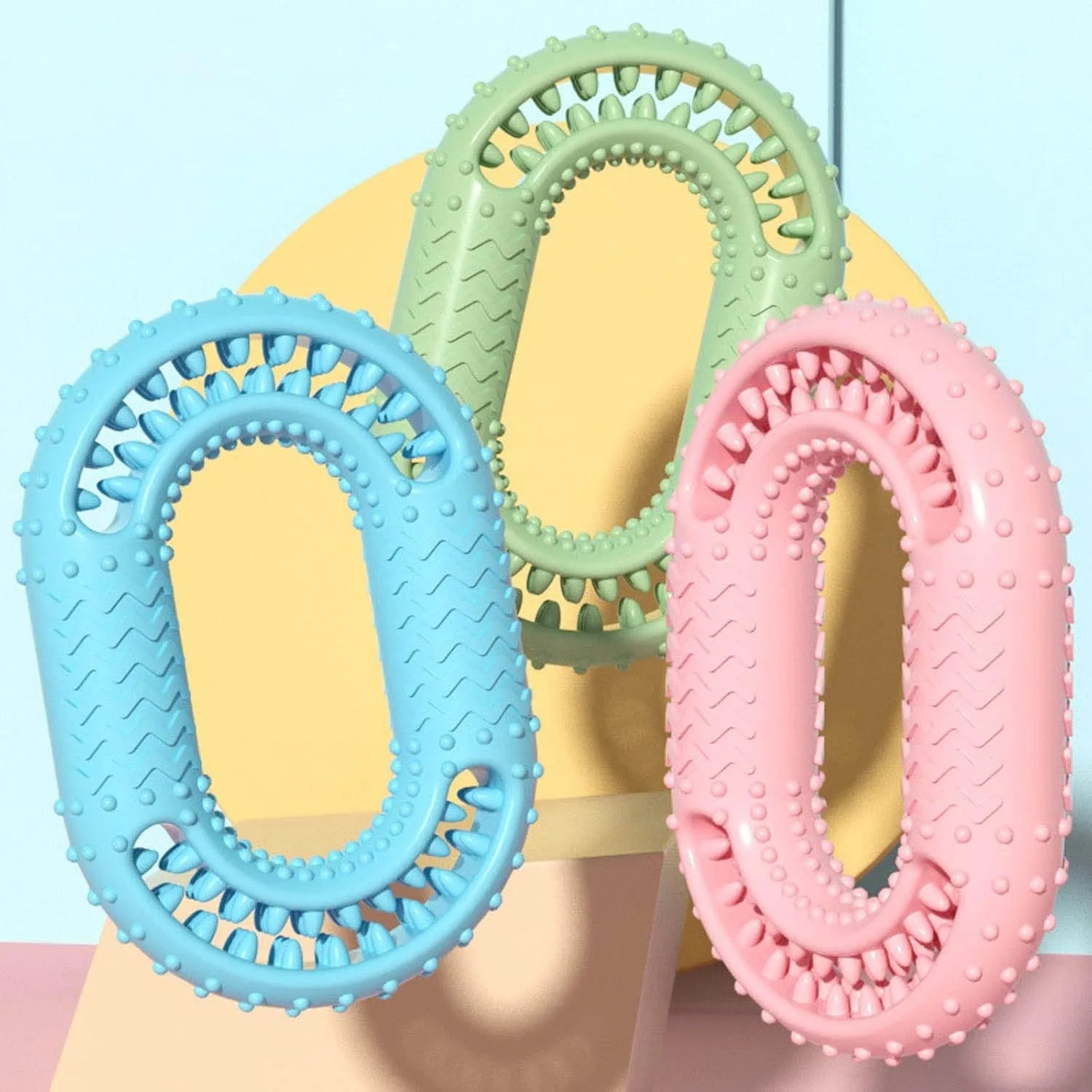 Blue green pink O-ring dog chew toy for aggressive chewers with dental benefits