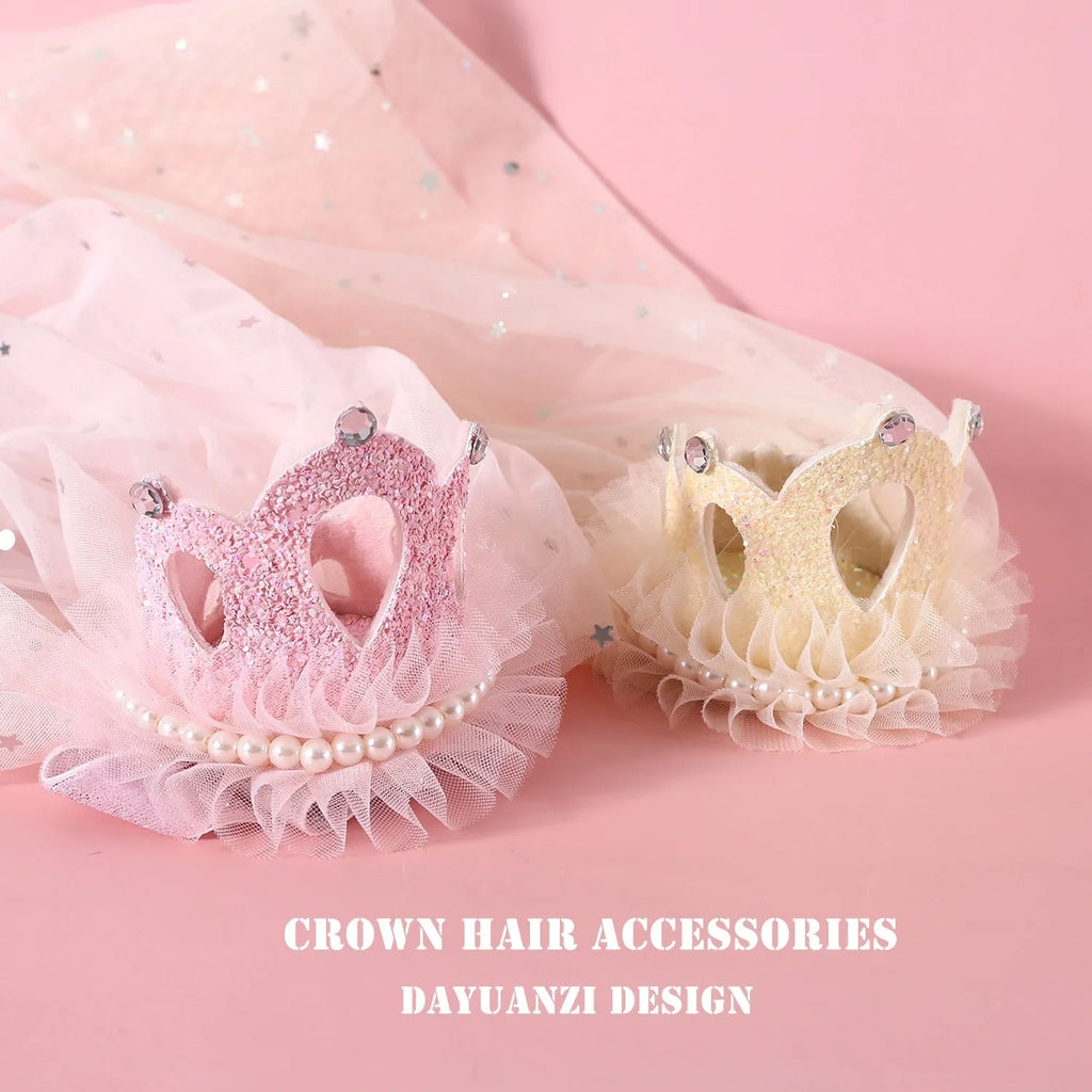 Beige and pink princess crown headdress with veil for cats on a plain background.