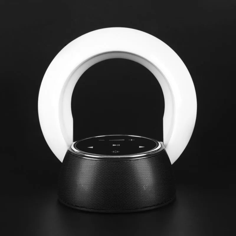 Blue and white Bluetooth speaker with integrated LED lamp showing touch controls and folding design