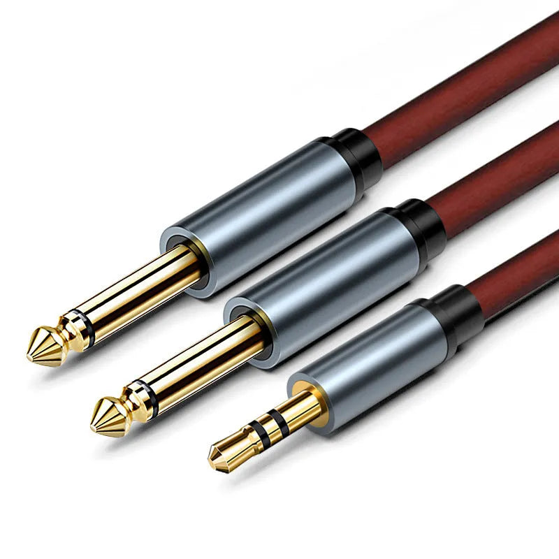 3.5mm to 6.5mm male-to-male stereo audio cable with gold connectors on a black cable.