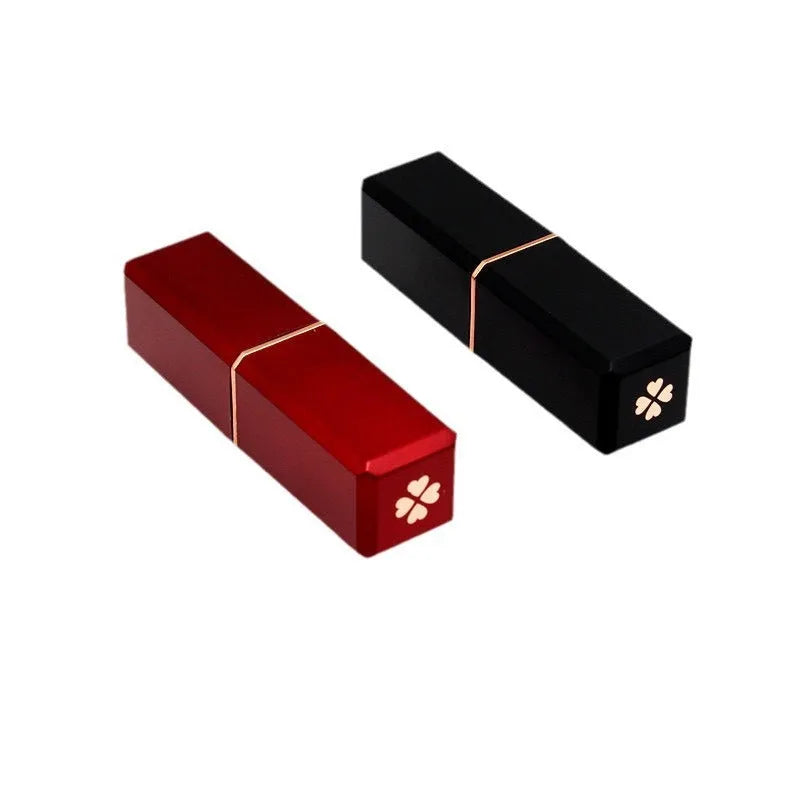 Empty 121 caliber lipstick tube in black, pink, red, or white ABS plastic for DIY cosmetics.