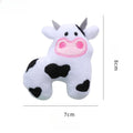 Plush cat toy shaped like a cow, crocodile, or parrot on a plain background.