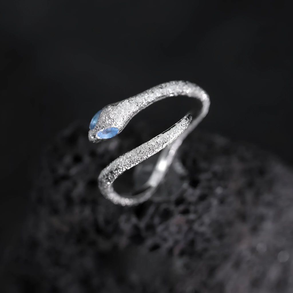 Silver adjustable snake ring with electroplated platinum finish and detailed zodiac design